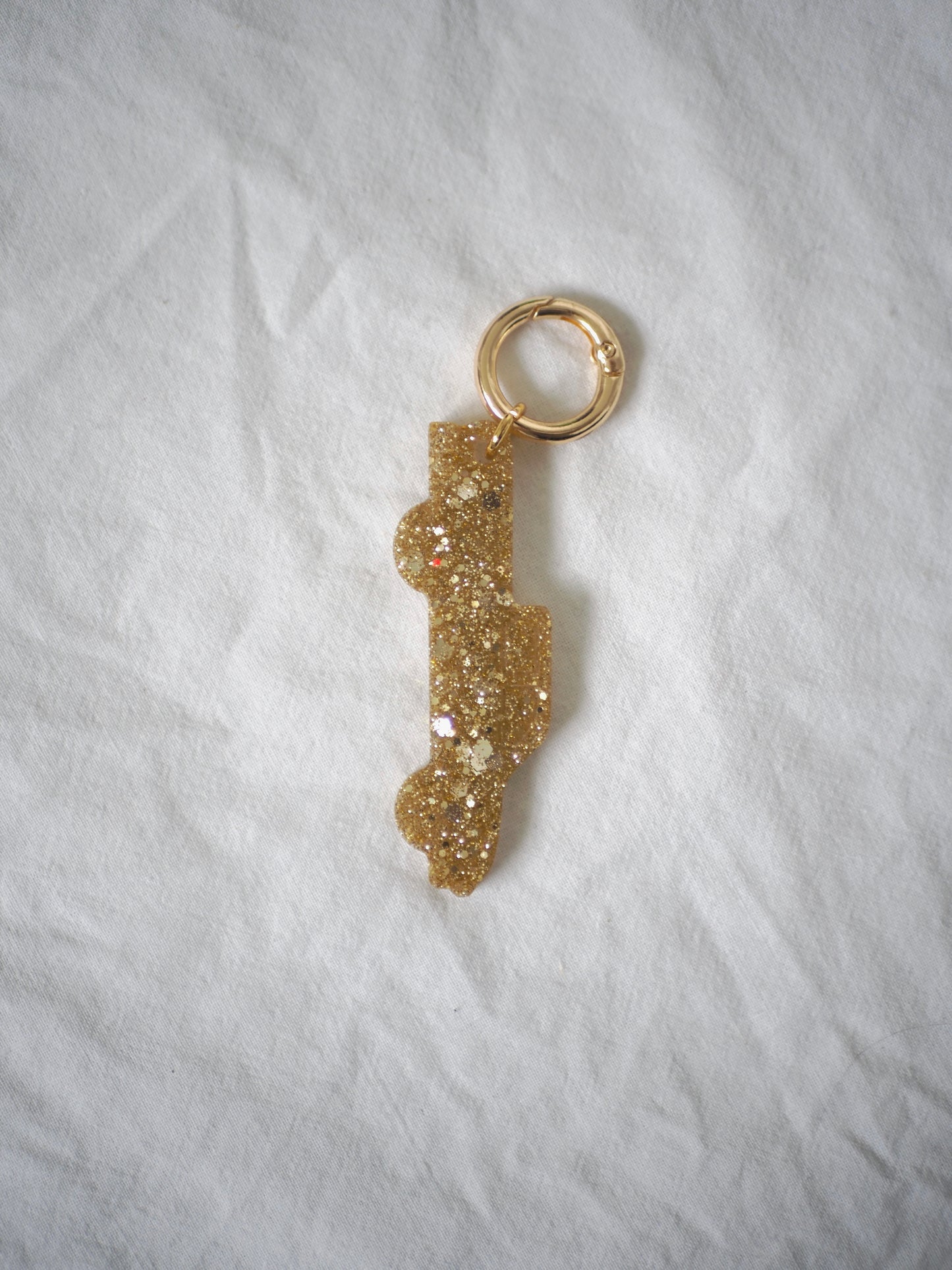 Grigri résine doré