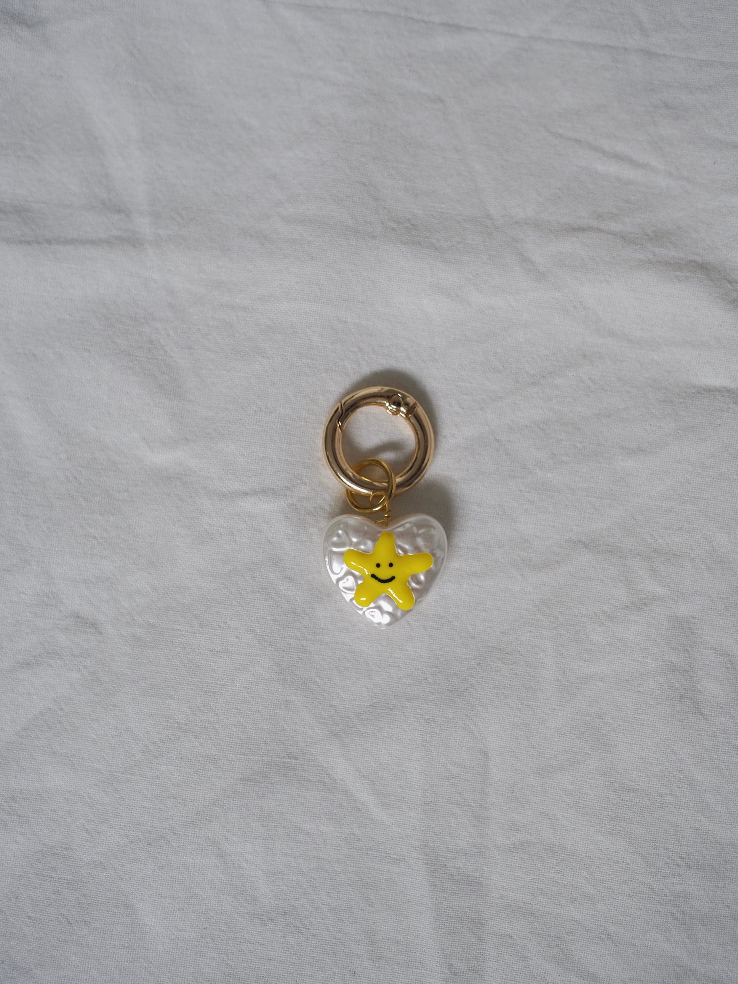 Grigri perle coeur smiley